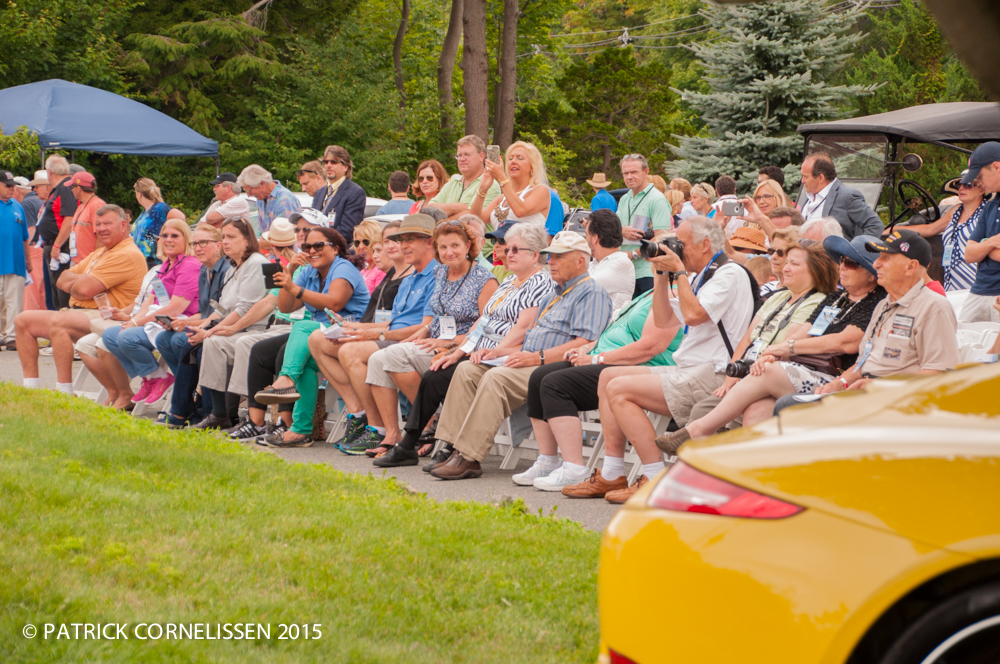 Crowd sitting on the lawn to observe Concours awards