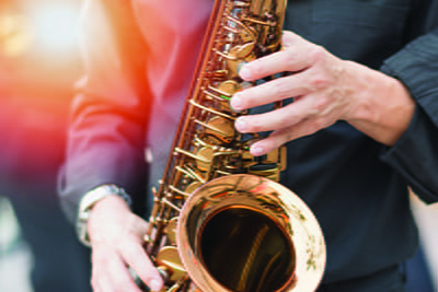 Close up image of someone playing the saxophone