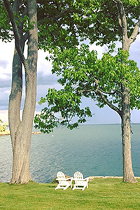 two beach chairs overlooking the ocean