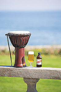 Raggae drum on a table with ocean in the background