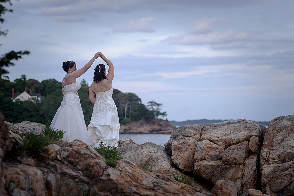 Wedding couple dancing on Misselwood rocks on the ocean