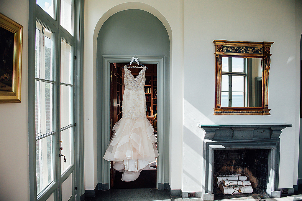 Bridal gown hanging in Misselwood house Ocean Room doorway